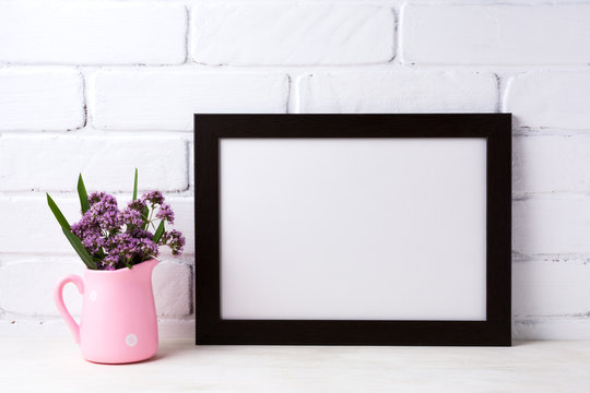 Black brown  landscape frame mockup with purple flowers in pink rustic pitcher