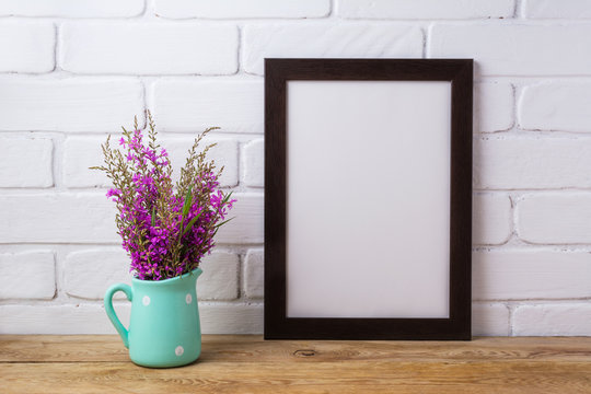 Black brown  frame mockup with maroon purple flowers in mint pitcher