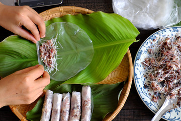 Woman making cha gio at home © xuanhuongho
