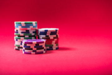 Gambling chips and cards on a green cloth Casino table