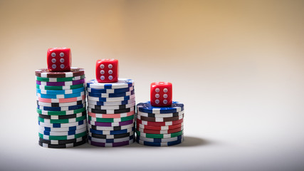 Gambling chips and cards on a green cloth Casino table