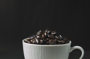 close up coffee bean with coffee cup