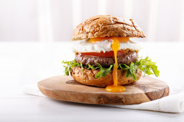 Close-up of beef burger on white background.