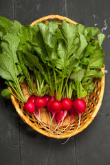 Red european radishes / Red radish / Red natural european radishes on a black background