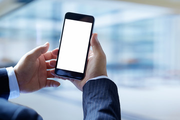 Businessman using Smartphone. Blank screen mobile phone for graphic display montage.
