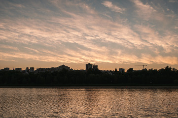 Fototapeta premium Summer sunset in the city, silhouette of buildings