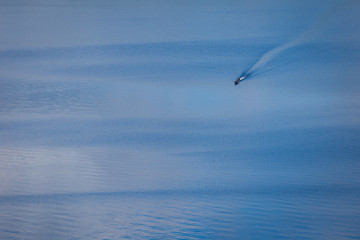 A man riding the boat in the lake