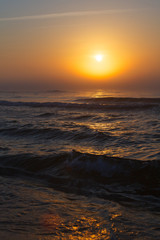 Obraz premium Beatiful red sunset over sea surface
