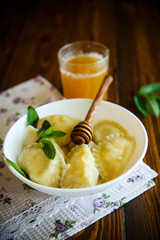 Homemade sweet ravioli with cottage cheese and honey