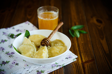 Homemade sweet ravioli with cottage cheese and honey