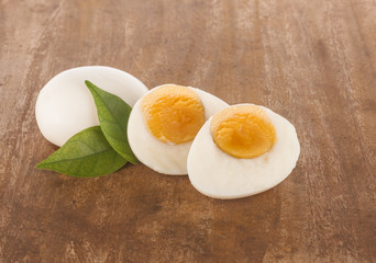 boiled eggs on wooden cutting board