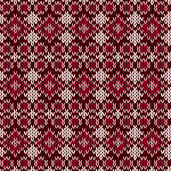 Knitted seamless pattern in red hues