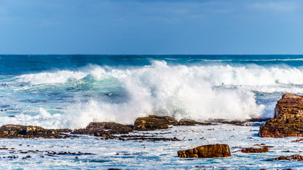 Waves of the Atlantic Ocean breaking on the rocky shores of Cape of Good Hope in Cape Point Nature Reserve on the Cape Peninsula in South Africa