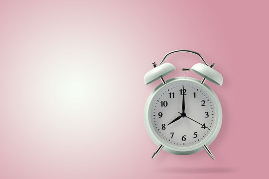 retro alarm clock on pink background, pastel alarm clock with clipping path