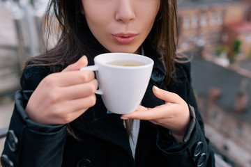 Girl at tea party in fresh air. Rest at nature, unrecognizable brunette woman