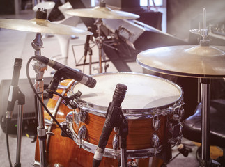 Fototapeta na wymiar Drums set with microphone on stage Concert entertainment event