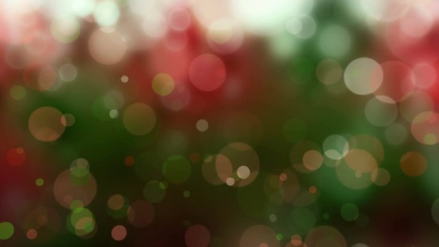 Abstract Christmas, holiday background - seamless looping, 4K, red and green defocused blur bokeh light background