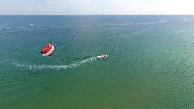 Parasailing in Black Sea in front of sandy beaches in Bulgaria Sozopol with wind of summer