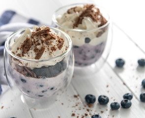 Dessert from yogurt with blueberries and chocolate 