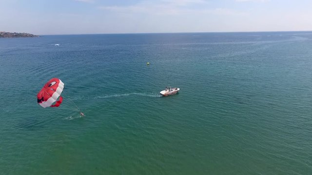 Parasailing in Black Sea in front of sandy beaches in Bulgaria Sozopol with wind of summer