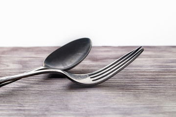 Spoon and fork on wooden a table