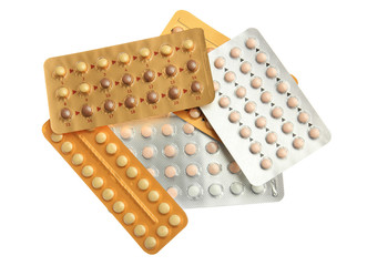 Strips of different oral contraceptive pills on white background