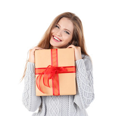 Pretty young lady holding gift box on white background