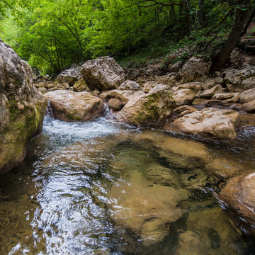 Mountain river with clean and fresh water in the rocks.