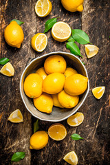 Ripe lemons in the old bucket.