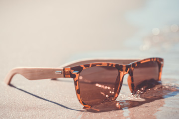 Summer. Vintage sunglasses on the beach