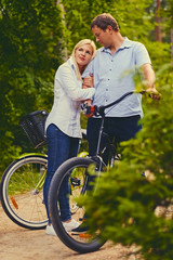 Fototapeta na wymiar A man and a woman on a bicycle ride.