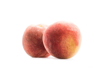 close up view of fresh and ripe peaches isolated on white