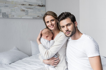 Fototapeta premium parents with cute baby
