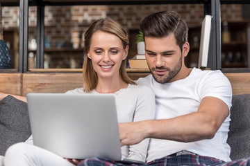 couple using laptop