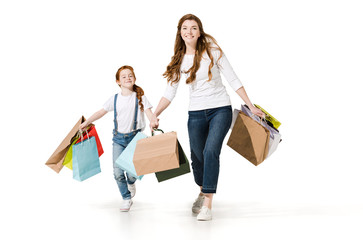 mother and daughter with shopping bags