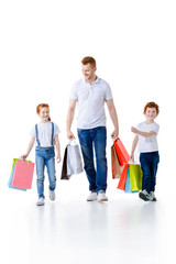 father with kids shopping together