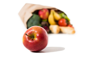 ripe apple and grocery bag