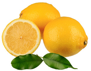 Lemons with green leaves, one lemon is cut