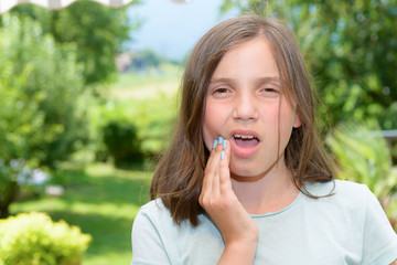 Fototapeta premium Young cute child girl have a toothache