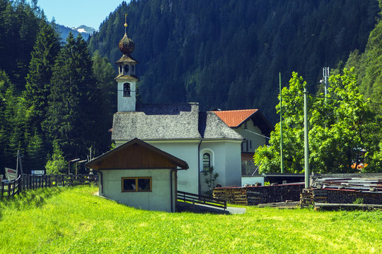 Background view of a small church in an alpine village in Tyrol