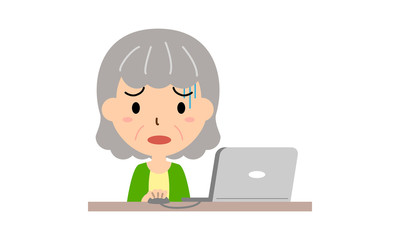 パソコン操作に困るシニア女性