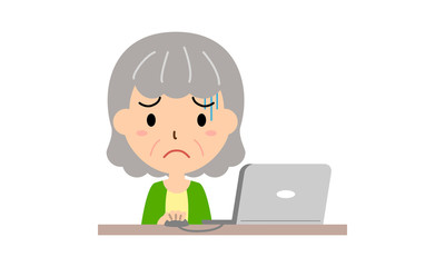 パソコン操作に困るシニア女性