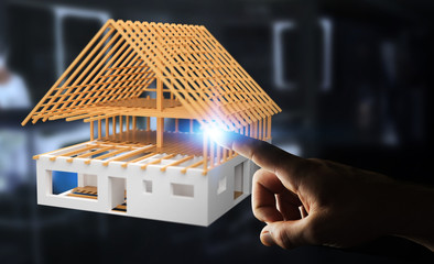 Businessman touching 3D rendering unfinished plan house with his finger