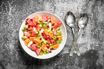 Tropical food . Fruit salad in a bowl.