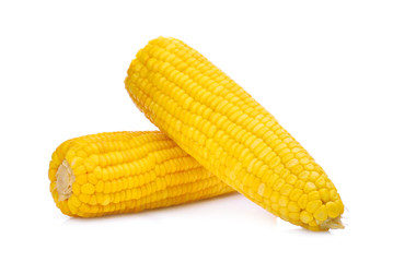 two ears of boiled sweet corn isolated on white background