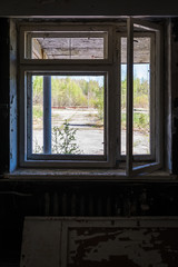 Broken window in abandoned house