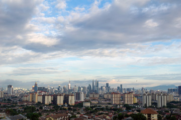 Fototapeta na wymiar Landscape view of downtown Kuala Lumpur skyline, Malaysia under cloudy blue sky