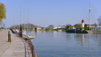 Fototapeta premium Port and lighthouse of Honfleur, commune in the Calvados department in the lower Normandy region in northwestern France