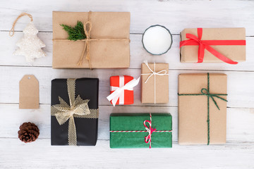 Christmas background - Christmas  handmade present gift boxes and rustic decoration on white wooden board. Creative Flat layout and top view composition.
