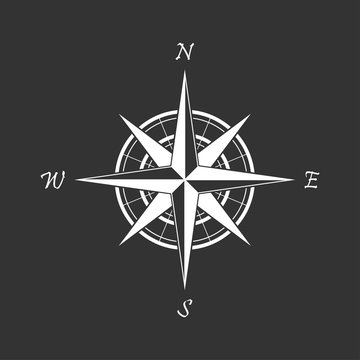 White compass icon on a black background. Marine navigation. Sign for adventure map. Vector illustration
